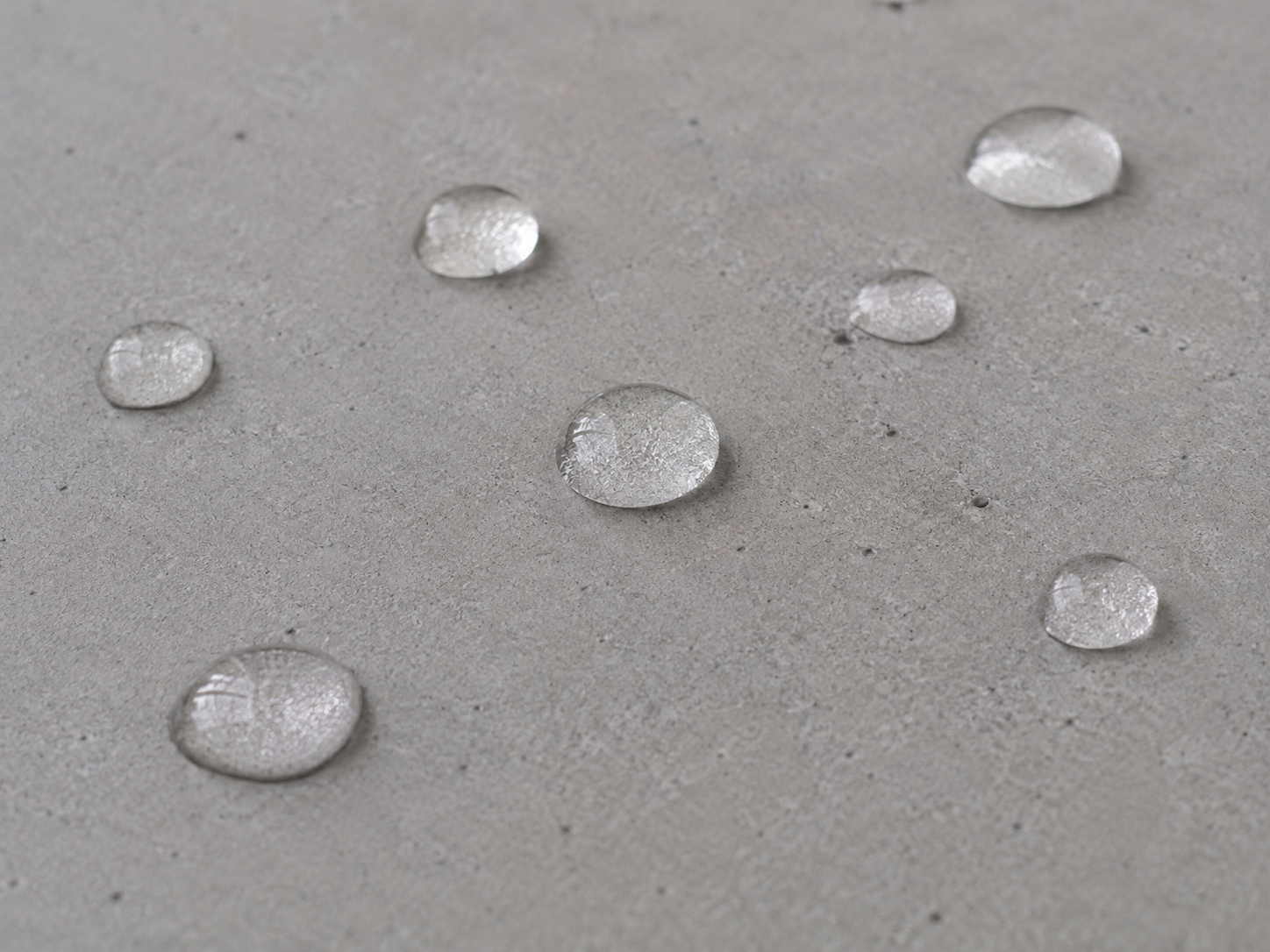 Water beading on tight concrete slab